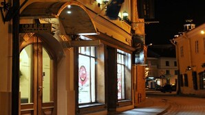 A hotel with a classic facade, large windows, and a sign indicating it is a hotel. - Centro Kubas - Angel (Vilnius)