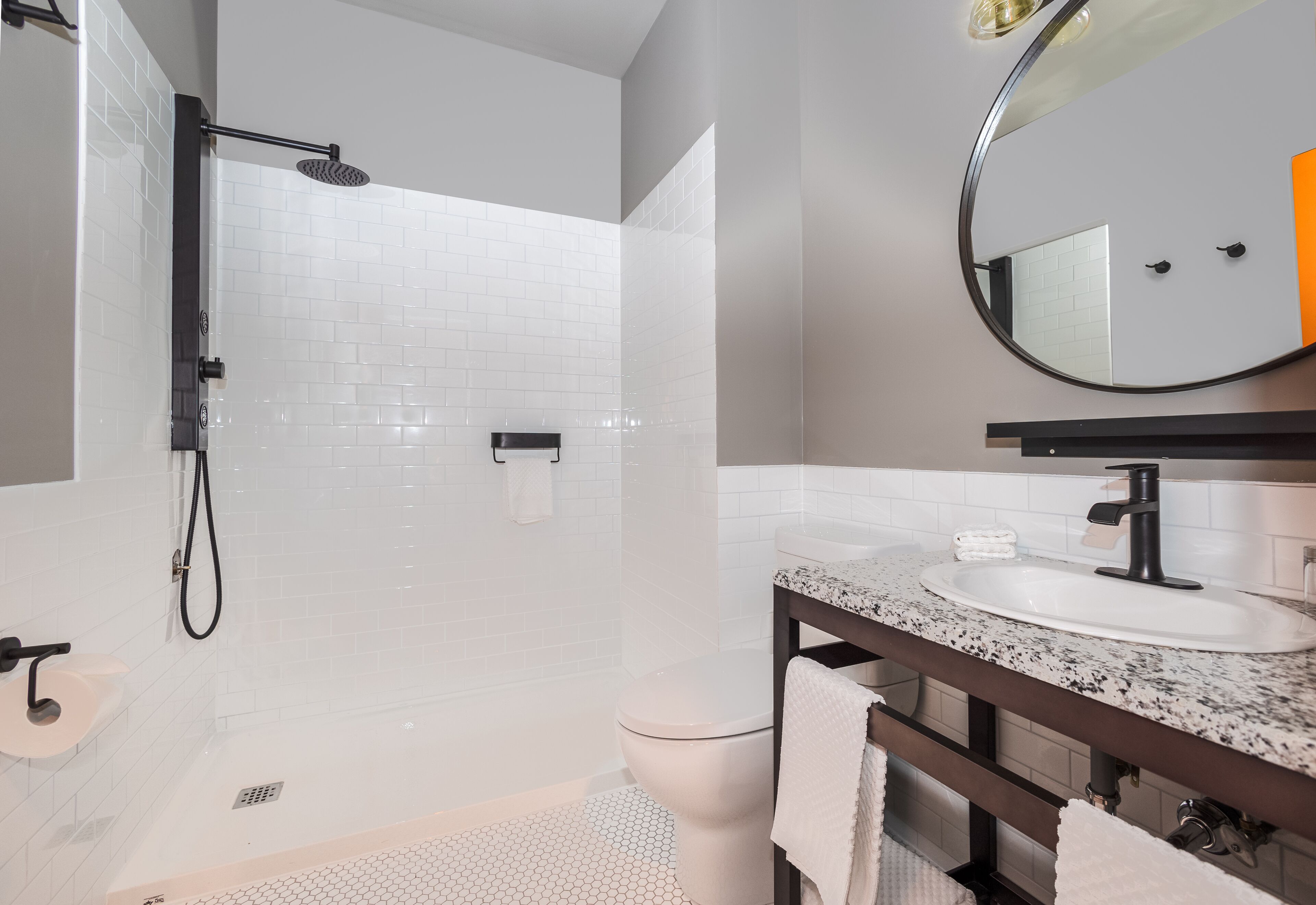 deluxe room, 1 king bed with sofa bed | bathroom | designer toiletries, hair dryer, dressing gowns, towels