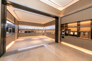 A modern kitchen with built-in appliances and a sleek design. - Ji Hotel (Hangzhou)