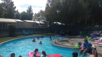 Seasonal outdoor pool, pool loungers