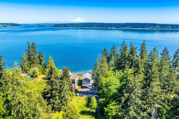 Wake up to a stunning view of the water and Mt Rainier in this spacious 4-bedroom, 3-bathroom family home in Longbranch