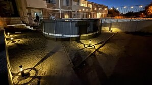 A building with a swimming pool, outdoor lighting, and a staircase leading to the entrance. - Shoreline Condo 4 Desert Oasis Free Wifi Cool  AC (San Felipe)
