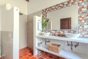 Bathtub, hair dryer, towels, soap