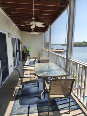 Outdoor dining - Lake Lodge Condo overlooking The swimming pool and the Lake of the Ozarks (Sunrise Beach)