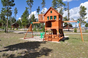 Children can play and relax in the playhouse with its multiple windows and balcony.