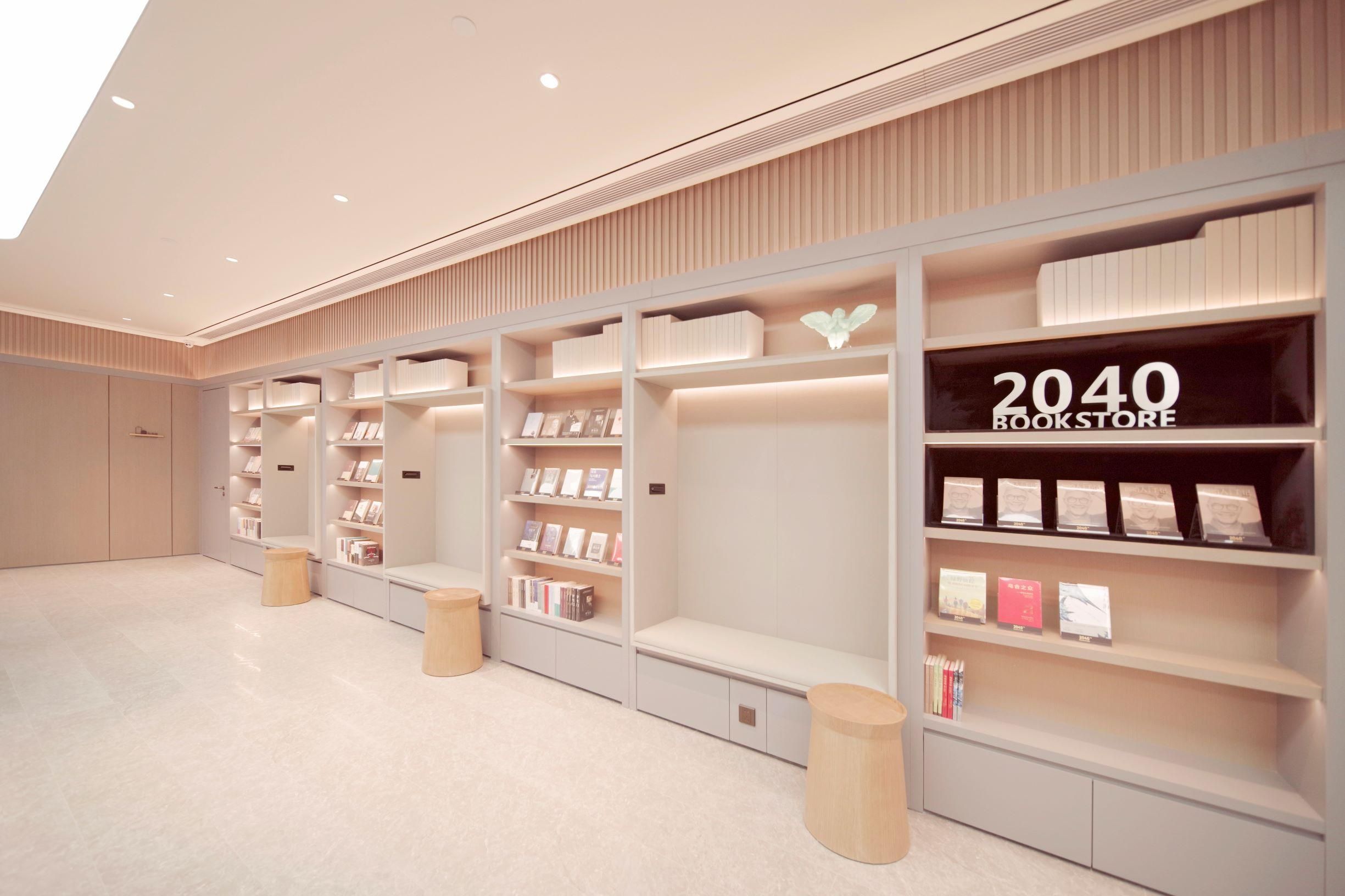 A modern bookstore interior with white shelving, books, and a '2040 BOOKSTORE' sign.