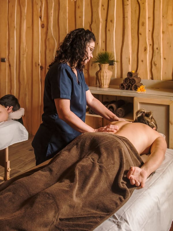 Experience a rejuvenating massage in a serene spa setting with a skilled practitioner.