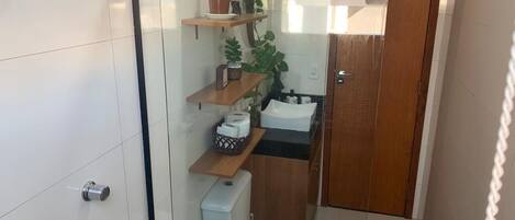 Shower, hair dryer, soap, toilet paper