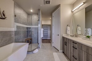 Combined shower/bathtub, hair dryer, towels, soap