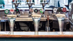 A bar with multiple taps, each labeled with different beer names. - Coogee Bay Hotel Pub Style (Sydney)