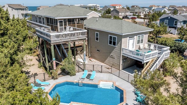 A two-story house with a swimming pool and multiple decks. - Oceans 20 | 480 ft. to the beach | Private Pool, Hot Tub (Virginia Beach)