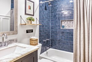 Combined shower/tub, hair dryer, towels, soap