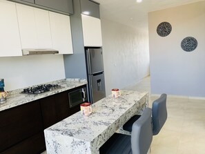 Fridge, microwave, stovetop, coffee/tea maker