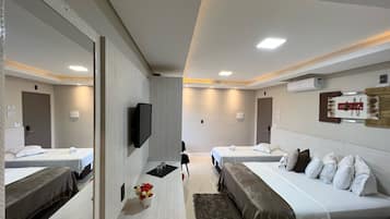 Premium Quadruple Room | In-room safe, desk, laptop workspace, blackout drapes
