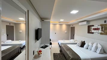 Premium Quadruple Room | In-room safe, desk, laptop workspace, blackout curtains