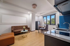 Apartment, 1 Bedroom, Sauna, City View | Minibar, in-room safe, desk, laptop workspace