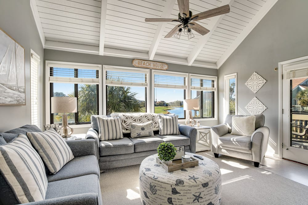 Stylish beach villa with pool, amenities, three decks, and golf course views