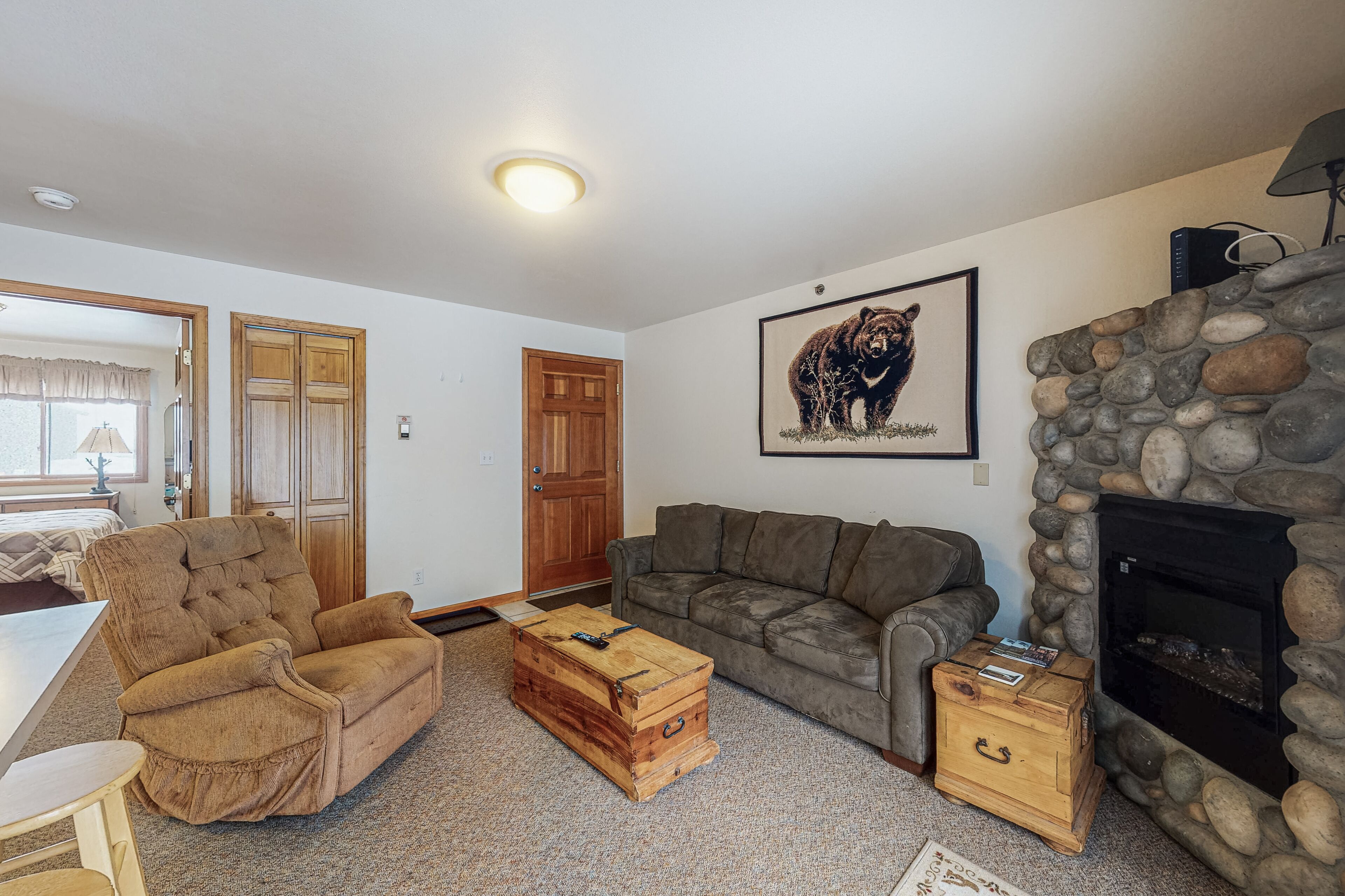 Riverfront condo with free wifi, fireplace, patio, & gas grill