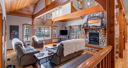 Expansive Riverfront Lodge with Dock, Game Room, Bar & Spacious Deck!