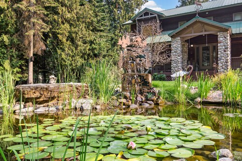 Expansive Riverfront Lodge with Dock, Game Room, Bar & Spacious Deck!