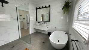 Bathtub, hair dryer, towels, soap