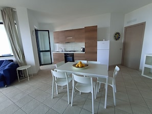 Panoramic Apartment, 1 Bedroom, Sea View | Private kitchen | Full-size fridge, oven, stovetop - Il corbezzolo Tropea residence (Ricadi)