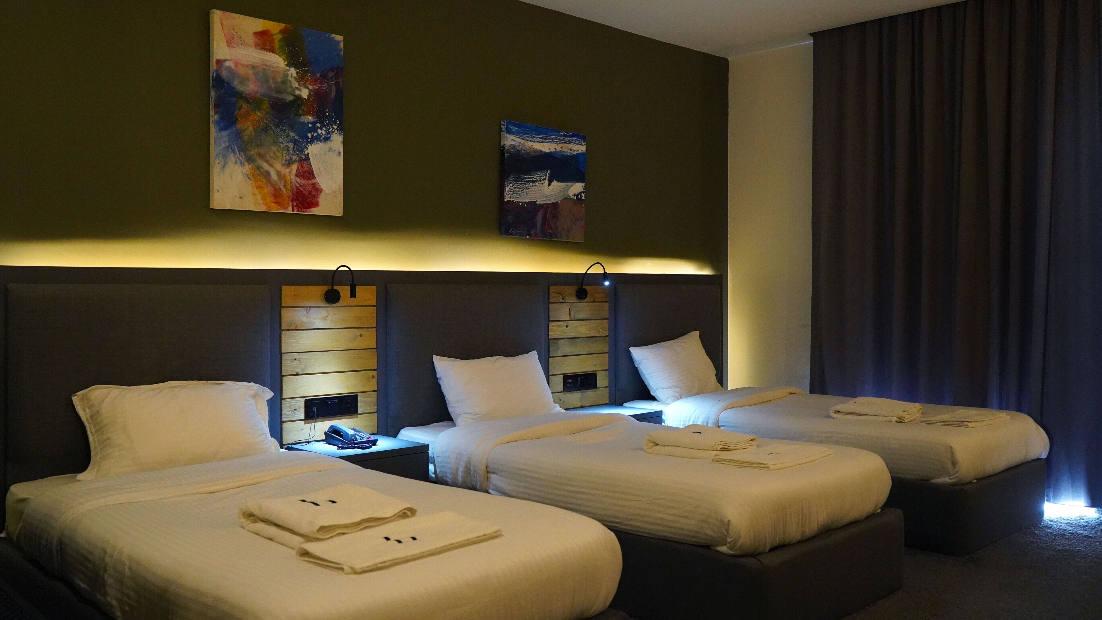 deluxe triple room | egyptian cotton sheets, premium bedding, down duvets, tempur-pedic beds