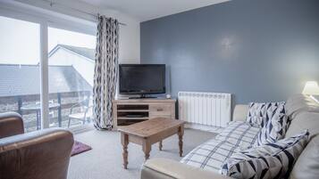 Apartment (2 Bedrooms) | Living area | 32-inch flat-screen TV with cable channels, TV