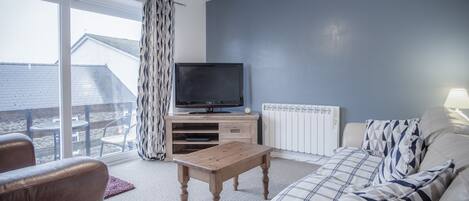 Apartment (2 Bedrooms) | Living area | 32-inch flat-screen TV with cable channels, TV