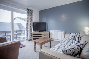 Apartment (2 Bedrooms) | Living area | 32-inch flat-screen TV with cable channels, TV