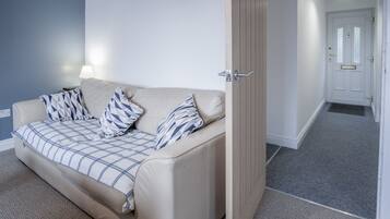 32-inch flat-screen TV with cable channels, TV