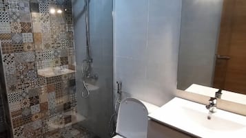 Shower, towels, soap, toilet paper