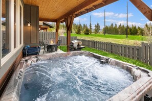 The Getaway: - Private hot tub with views of the driving range.