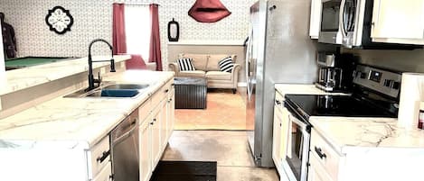 Fridge, coffee/tea maker, cookware/dishes/utensils