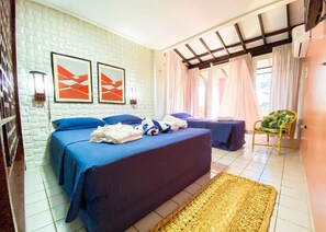 A hotel room with two beds, a woven rug, and a chair. - Aimberê Eco Resort Hotel (Luis Correia)