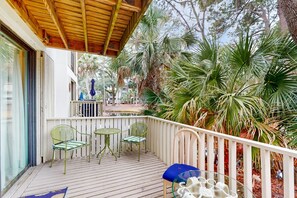 Relax on the deck surrounded by lush tropical plants and enjoy the view.