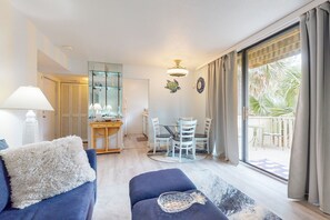 Relax in this inviting living area with a sofa, dining table, and comfortable seating.