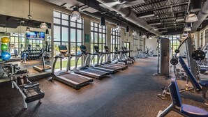 A gym with treadmills, weight machines, and exercise balls. - “Magical Memories Manor” - Awesome Movie and Game Rooms (Kissimmee)