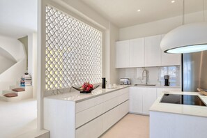 Villa | Private kitchen | Dining tables