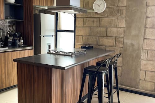 Exclusive Studio Suite, 2 Bedrooms | Private kitchen | Full-size fridge, microwave, oven, stovetop