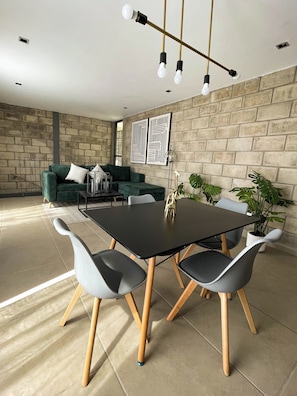 Exclusive Studio Suite, 2 Bedrooms | Living room | 42-inch Smart TV with digital channels, TV