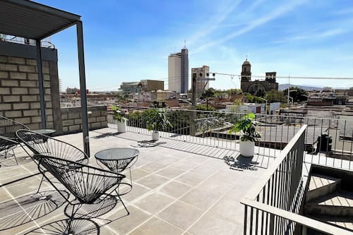 Exclusive Studio Suite, 2 Bedrooms | Living room | 42-inch Smart TV with digital channels, TV
