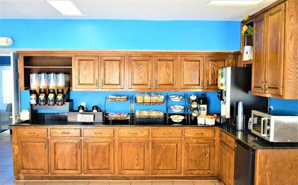 Enjoy cooking in this fully equipped kitchen with oven, microwave, and coffee maker.