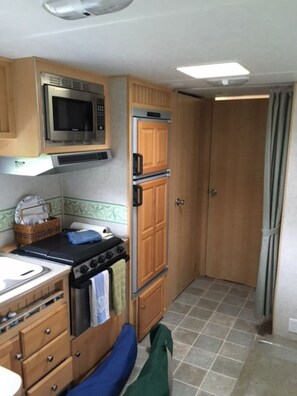 Fridge, microwave, stovetop, coffee/tea maker