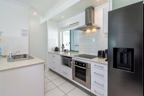 Fridge, microwave, oven, dishwasher - Keith's on Sylvan Beach. Stylish 2BR unit with awesome Pumistone Passage views. (Bellara)
