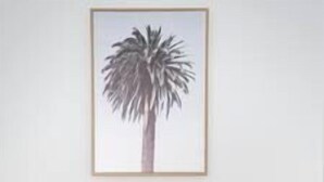 A white desk with two drawers and a framed picture of a palm tree on the wall above it. - Blue Haven Retreat - Beverly Hills 208 (Beverly Hills)
