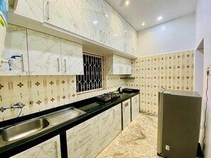 Fridge, stovetop, electric kettle, cookware/dishes/utensils - Laxmi Villa: Premium 3BHK Villa located in Anjuna Goa. (Anjuna)