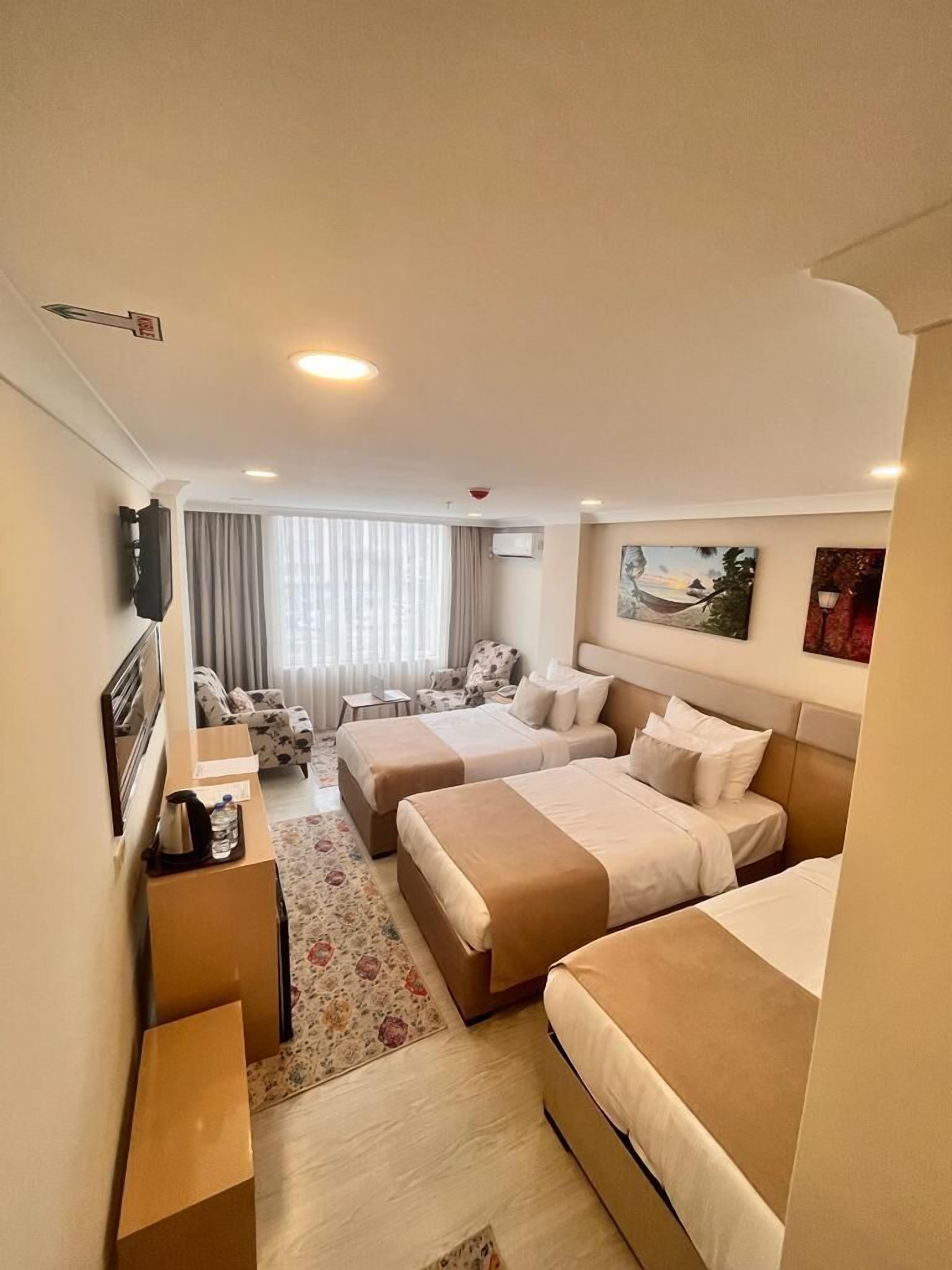 Family Triple Room | Egyptian cotton sheets, premium bedding, in-room safe, desk