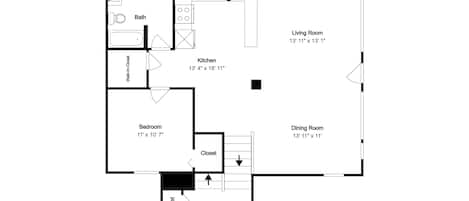 A floor plan with a living room, dining room, kitchen, bathroom, bedroom, and foyer.