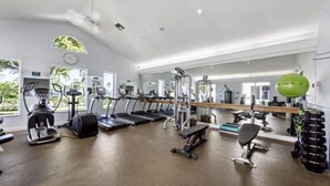 A gym with treadmills, elliptical machines, and free weights. - 5 Miles to the beach, family home, saltwater pool, pickleball & tennis courts (Naples)